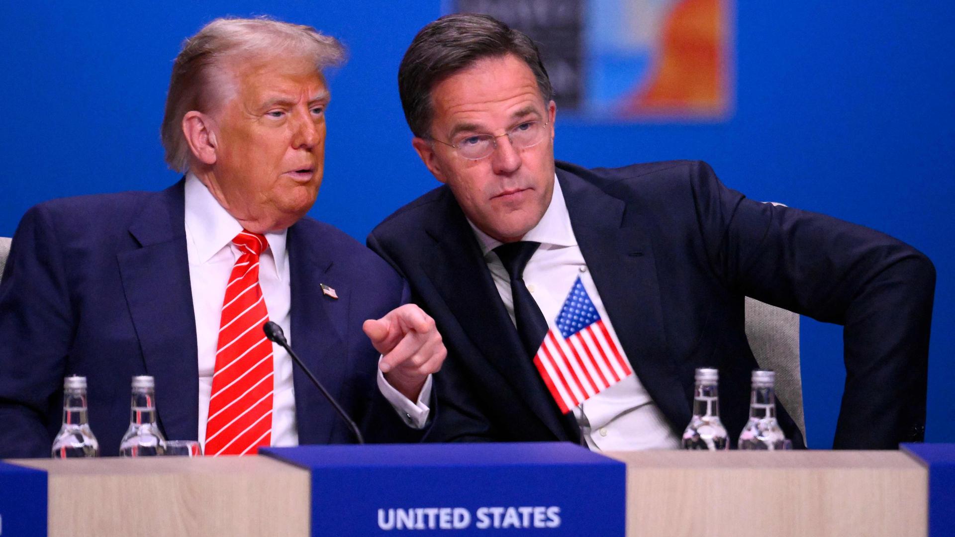 US President Donald Trump and NATO Secretary General Mark Rutte speak at the start of a NATO leaders summit in The Hague, Netherlands June 25, 2025. (Photo by JOHN THYS / AFP)