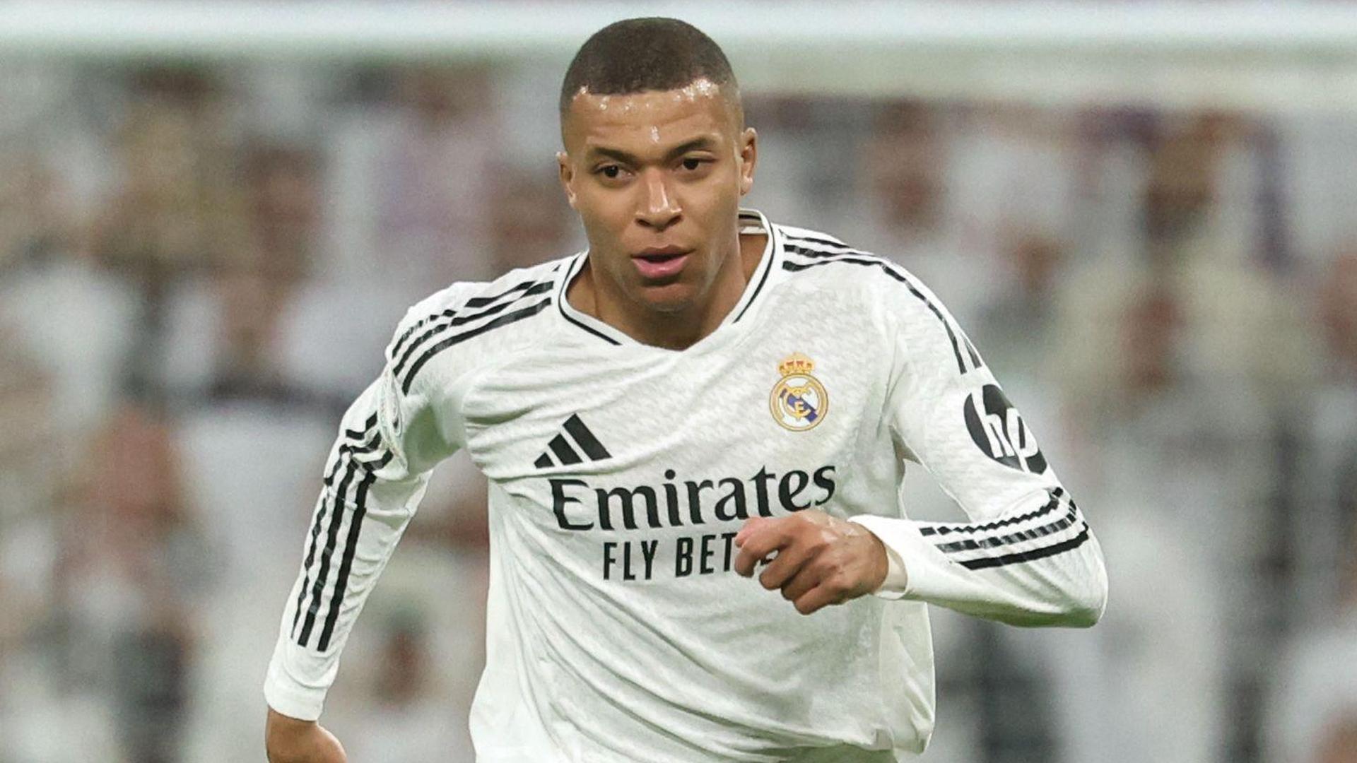 (FILES) Real Madrid's French forward #09 Kylian Mbappe controls the ball during the UEFA Champions League, league phase football match between Real Madrid CF and FC Salzburg at the Santiago Bernabeu stadium in Madrid on January 22, 2025. Lionel Messi, Ousmane Dembele, Kylian Mbappe, Rodri, and Harry Kane are some of the great football figures who will add shine to the FIFA Club World Cup. (Photo by Pierre-Philippe MARCOU / AFP)