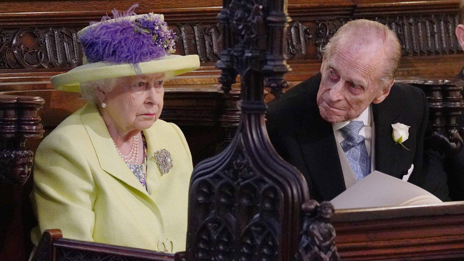WINDSOR, UNITED KINGDOM - MAY 19: Queen Elizabeth II and  Prince Philip, Duke of Edinburgh attend the wedding of Prince Harry to Meghan Markle  at St George's Chapel at Windsor Castle on May 19, 2018 in Windsor, England. (Photo by Jonathan Brady - WPA Pool/Getty Images)
