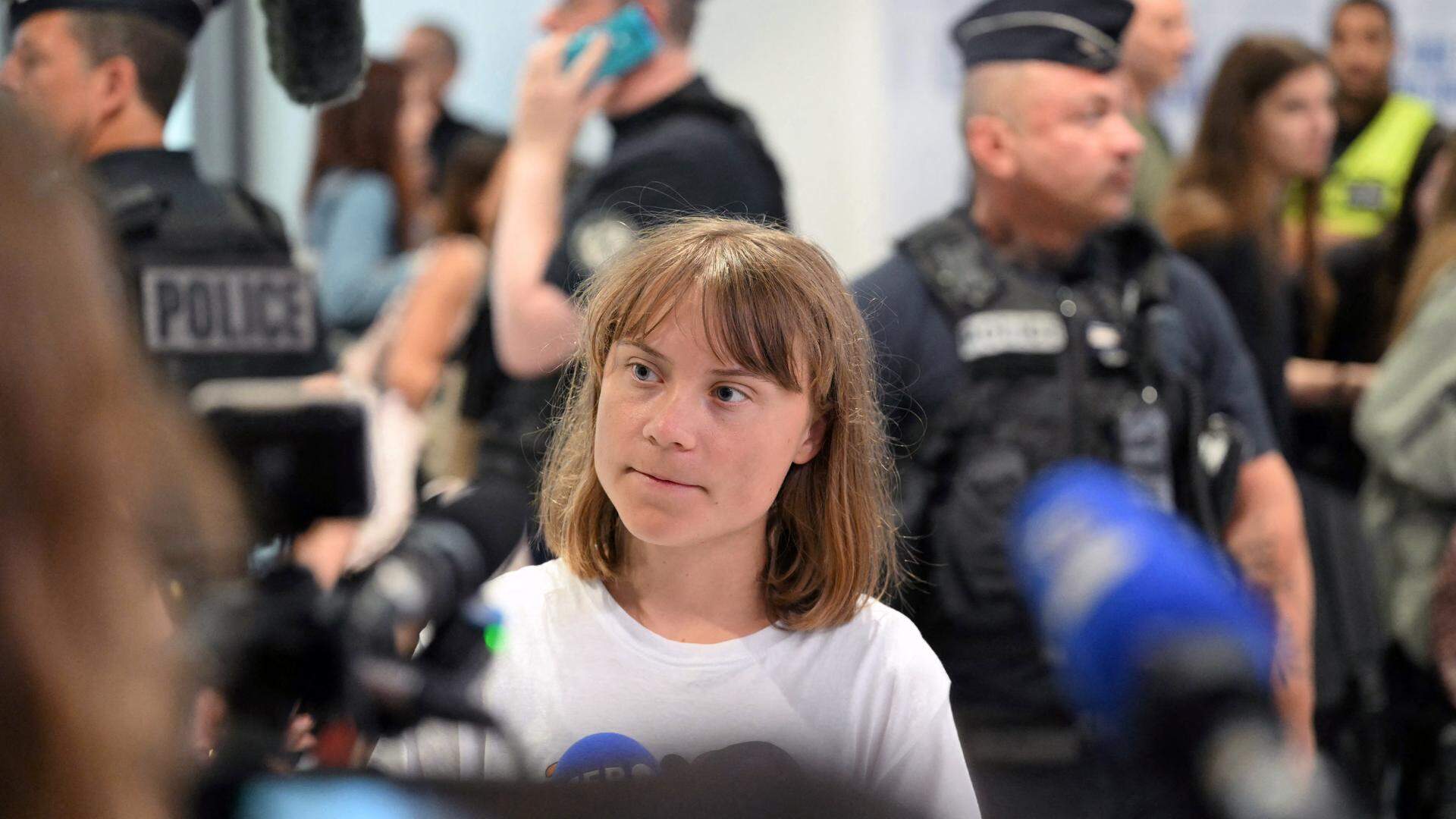 Swedish campaigner Greta Thunberg talks to journalists upon her arrival to Roissy-Charles de Gaulle Airport, as she left Israel on a flight to Sweden via France, after she was detained along with other activists aboard a Gaza-bound aid boat, on June 10, 2025. Thunberg departed Israel on a flight from Tel Aviv to Sweden (via France). Of the 12 people on board the Madleen carrying food and supplies for Gaza, five French activists were taken into custody after they refused to leave Israel voluntarily. 
Hugo MATHY / AFP