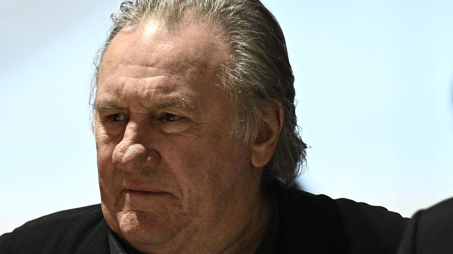 French actor Gerard Depardieu arrives on the fourth day of his trial in which he is charged with sexually assaulting two women during a film shoot in 2021, at the Paris criminal court in the Tribunal de Paris courthouse, on March 27, 2025.  Depardieu, 76, who has made more than 200 films and television series, has been accused of improper behaviour by around 20 women but this is the first case to come to trial. The two plaintiffs -- Amelie, 54, a set dresser, and Sarah (name changed), 34, an assistant director -- allege sexual assault during the filming in 2021 of "Les Volets Verts" ("The Green Shutters") by director Jean Becker.
JULIEN DE ROSA / AFP